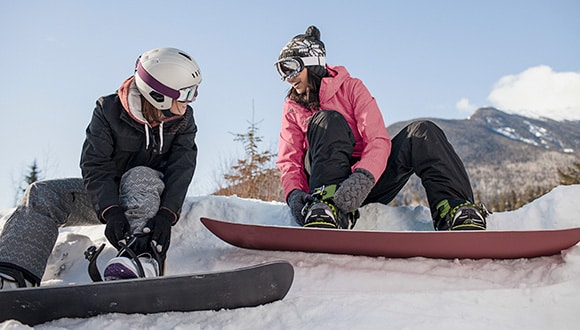 2 people on snowboards